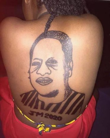 Woman tattoos former President John Dramina Mahama at her back