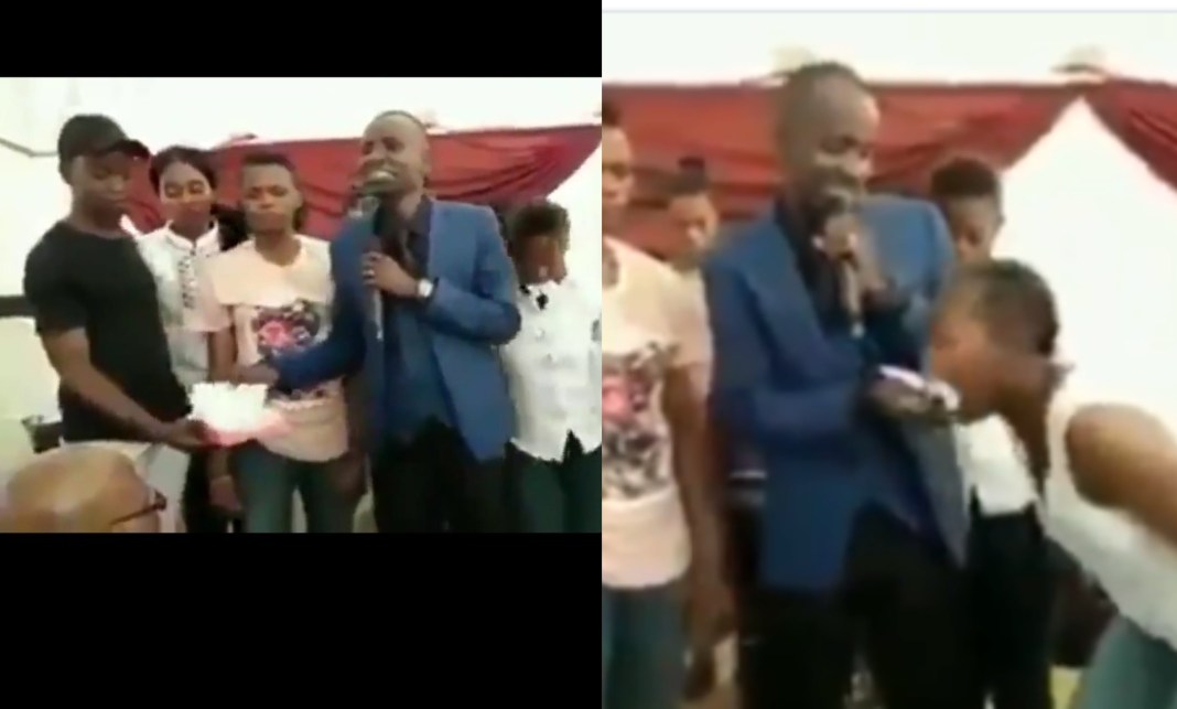 Pastor tears bible, forcibly feeds it to church members (video)